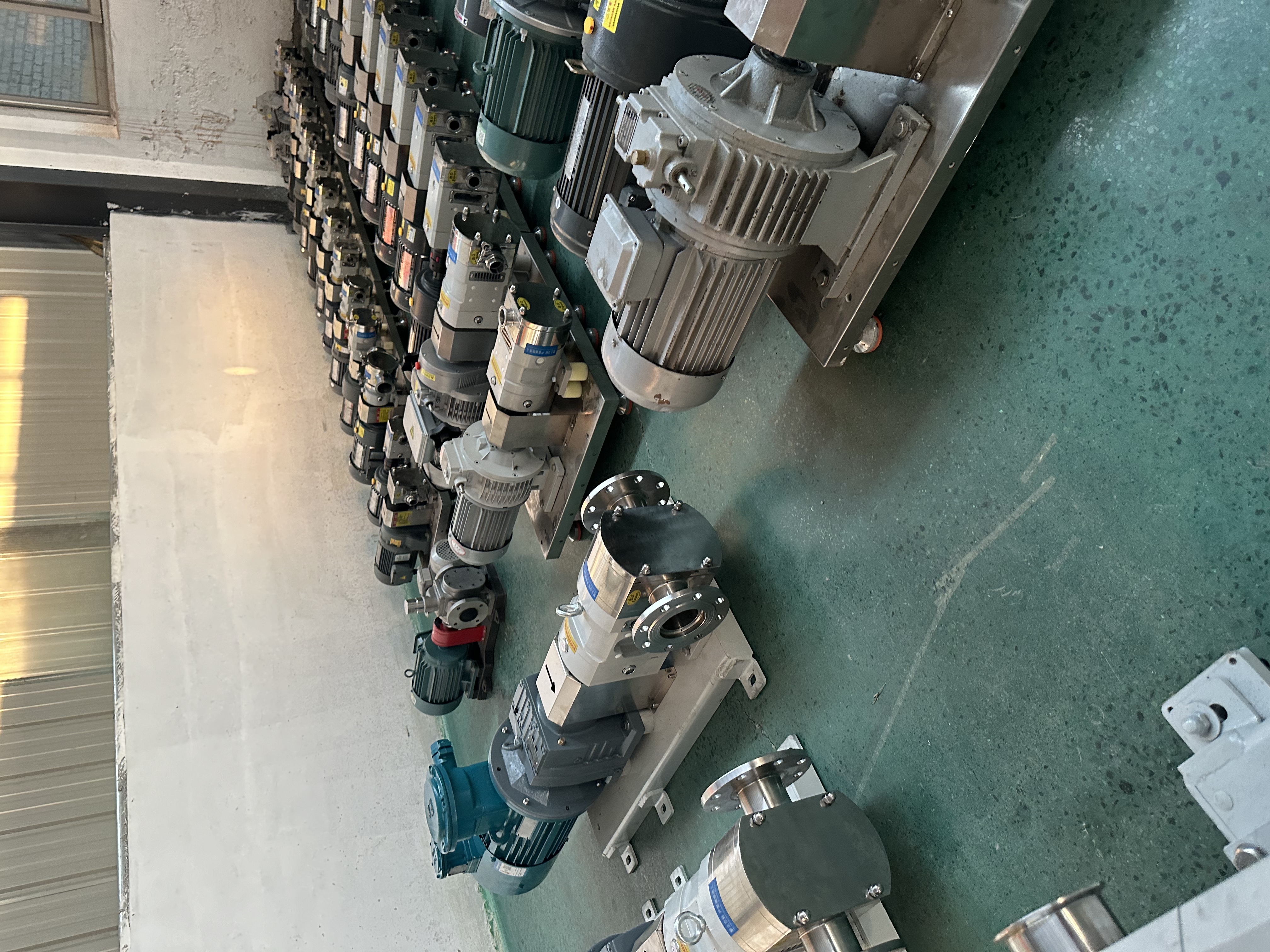 Supplied workshop photograph showing assembled pump and motor units